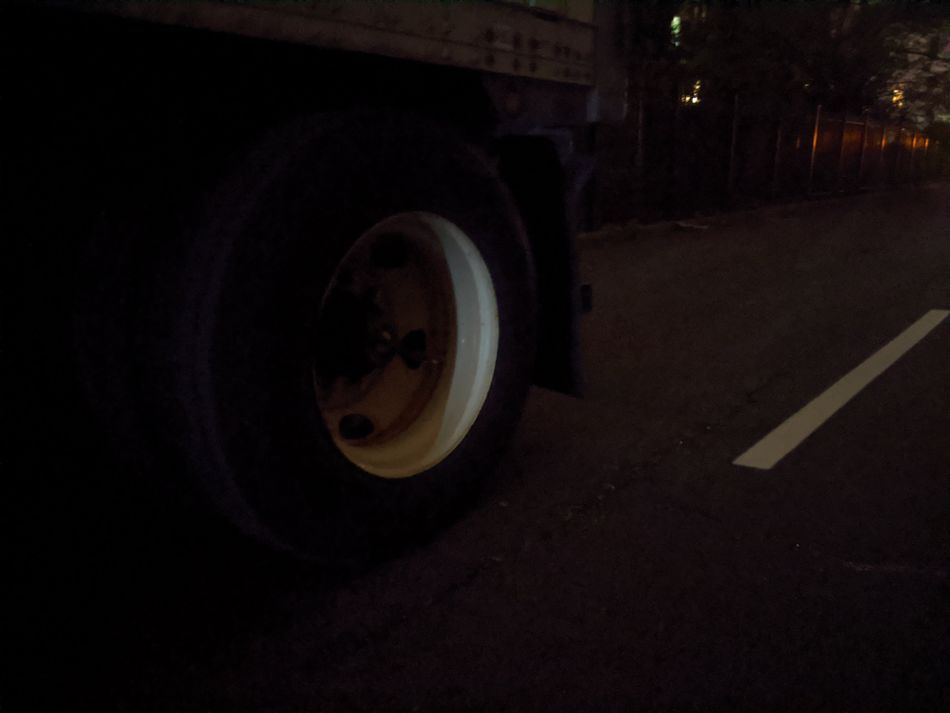 This truck wheel in a back alley with next to no lighting was barely visible to my eyes.